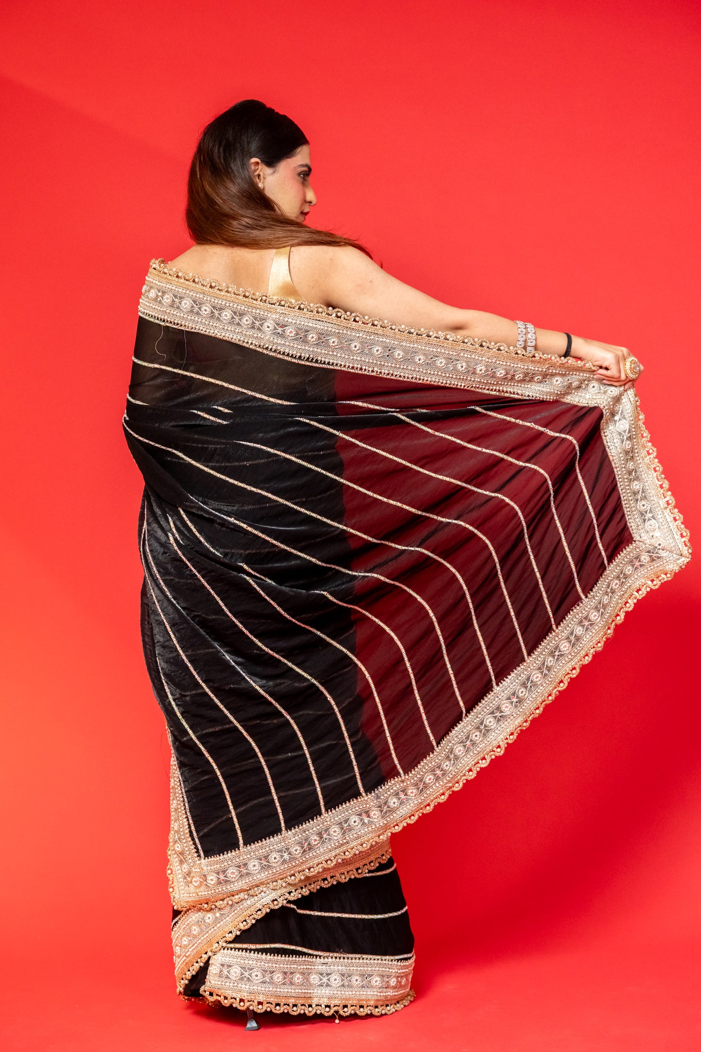 Midnight Black Tissue Silk Saree with Intricate Golden Embroidery