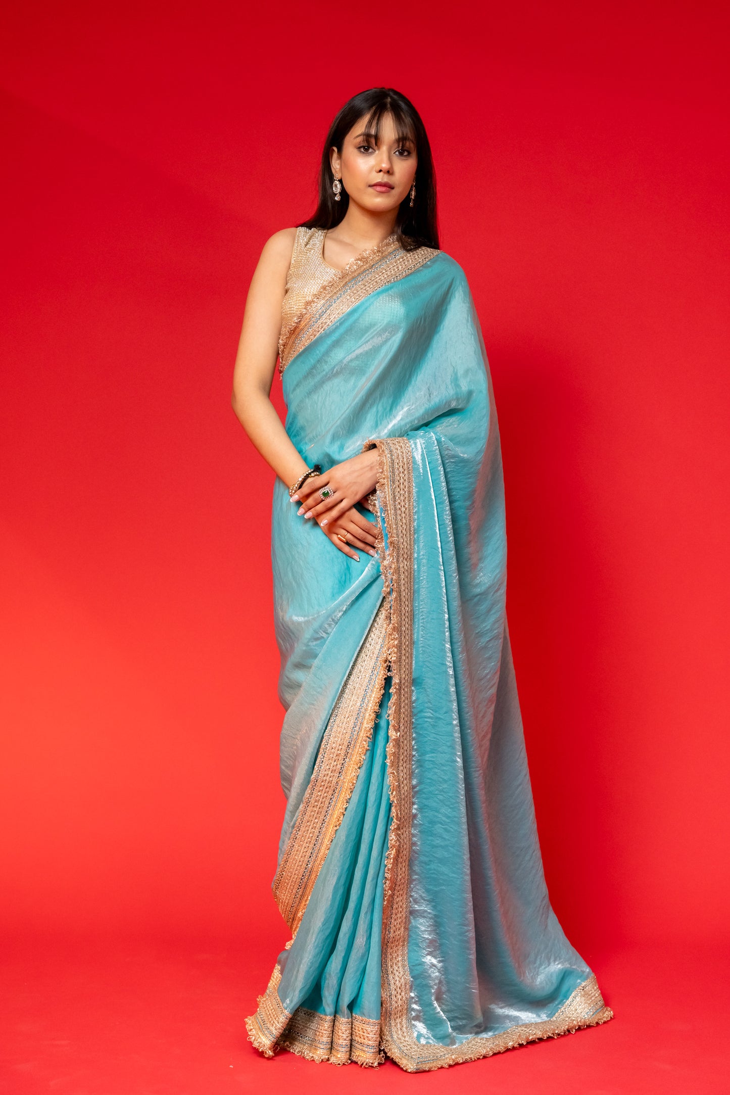 Elegant Sky Blue Tissue Saree with Golden Embellished Border