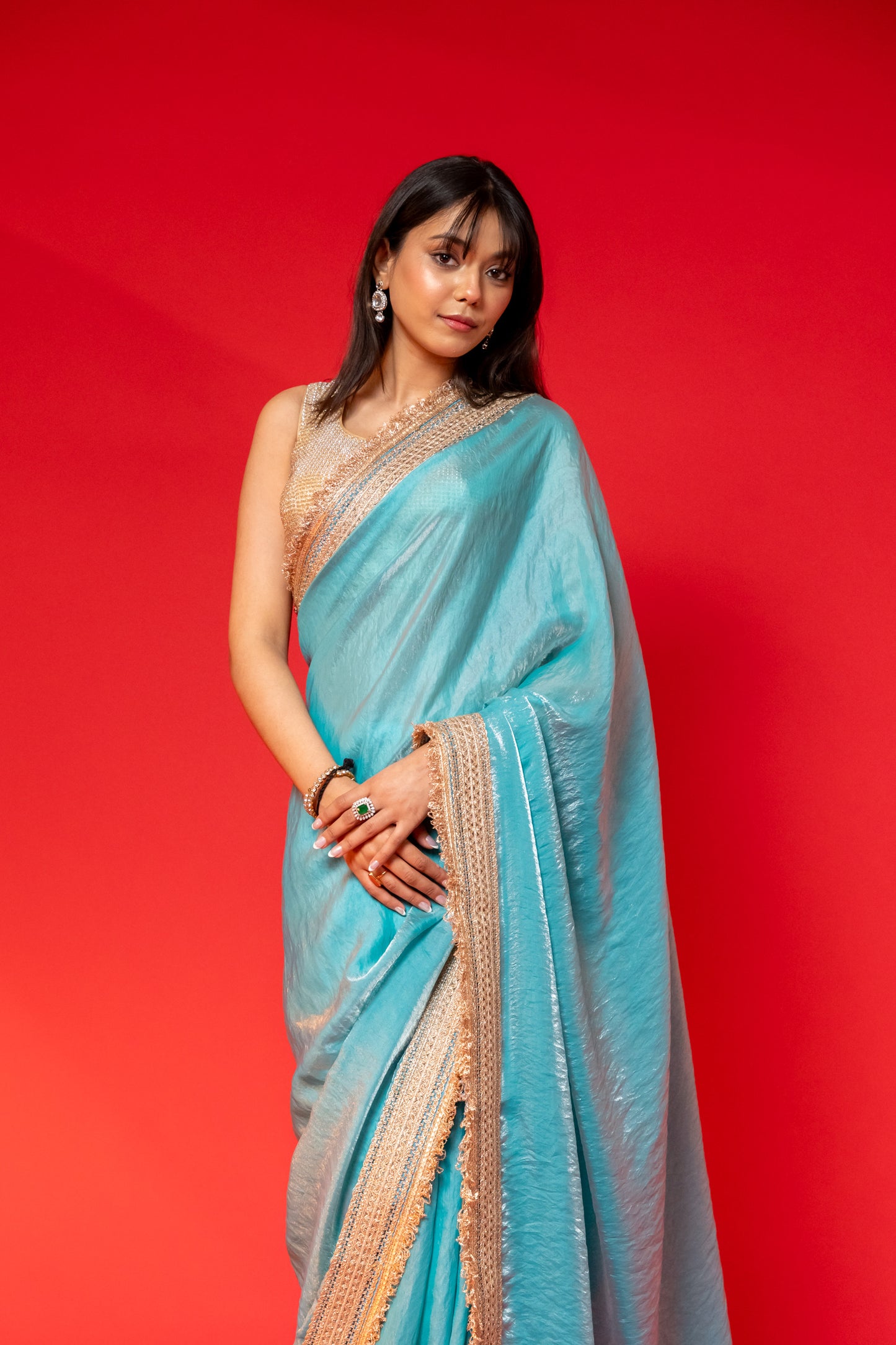 Elegant Sky Blue Tissue Saree with Golden Embellished Border