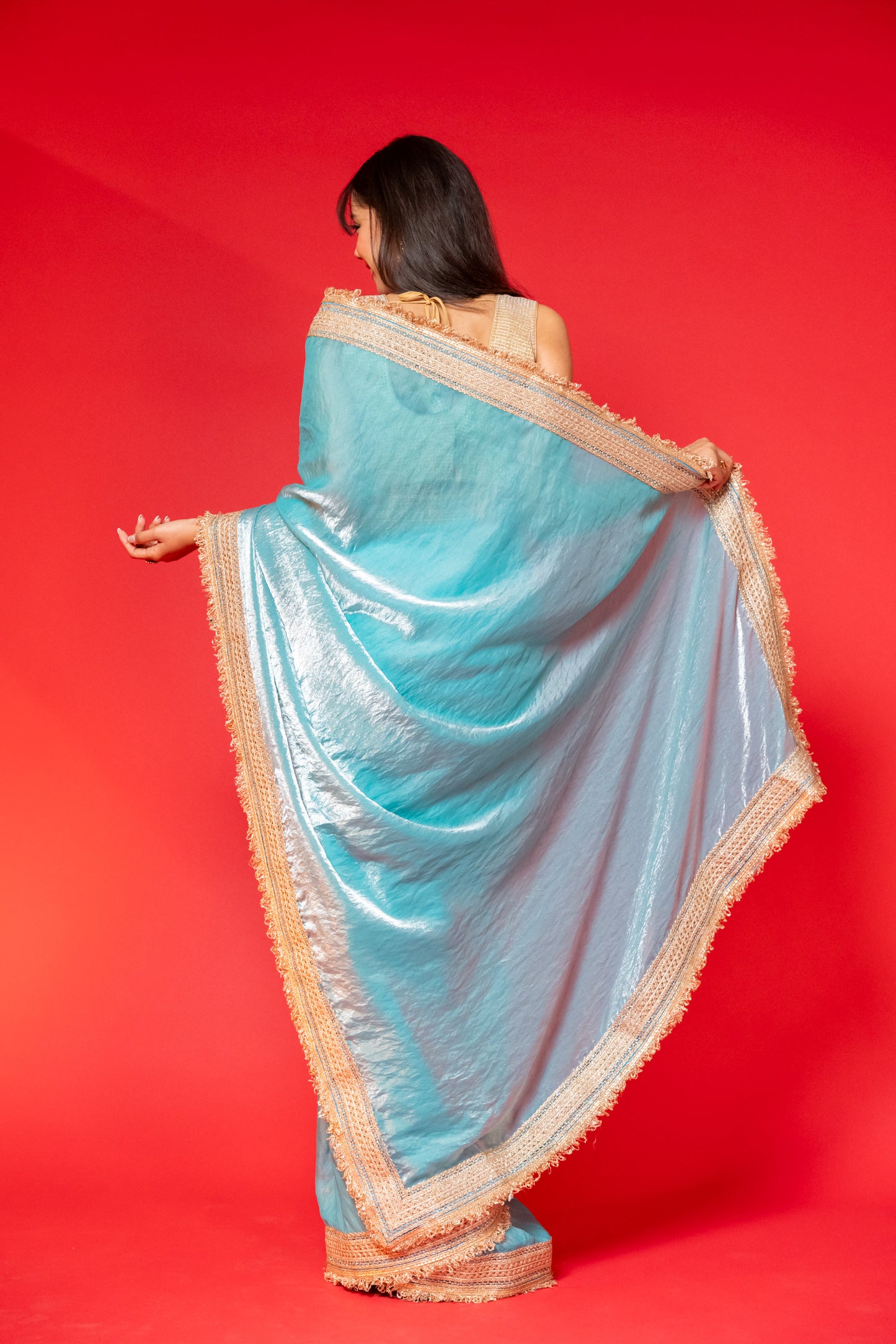 Elegant Sky Blue Tissue Saree with Golden Embellished Border