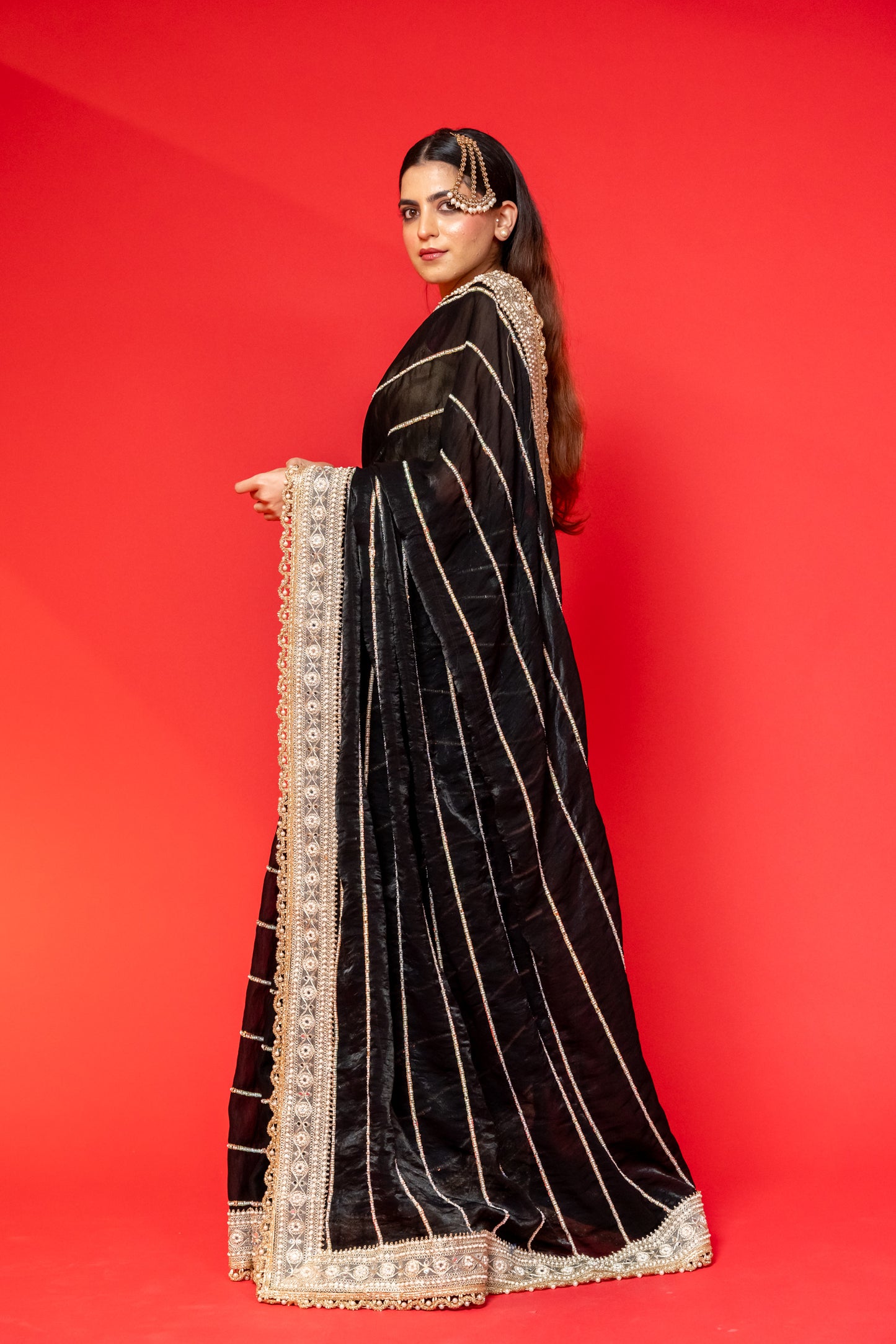 Midnight Black Tissue Silk Saree with Intricate Golden Embroidery