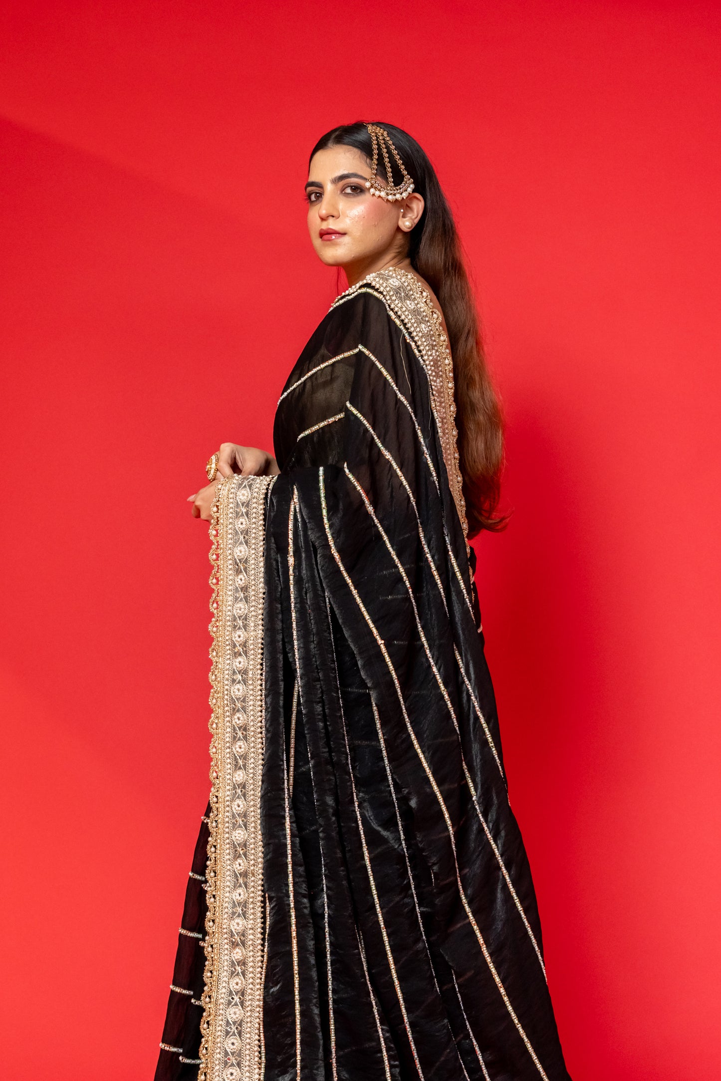 Midnight Black Tissue Silk Saree with Intricate Golden Embroidery